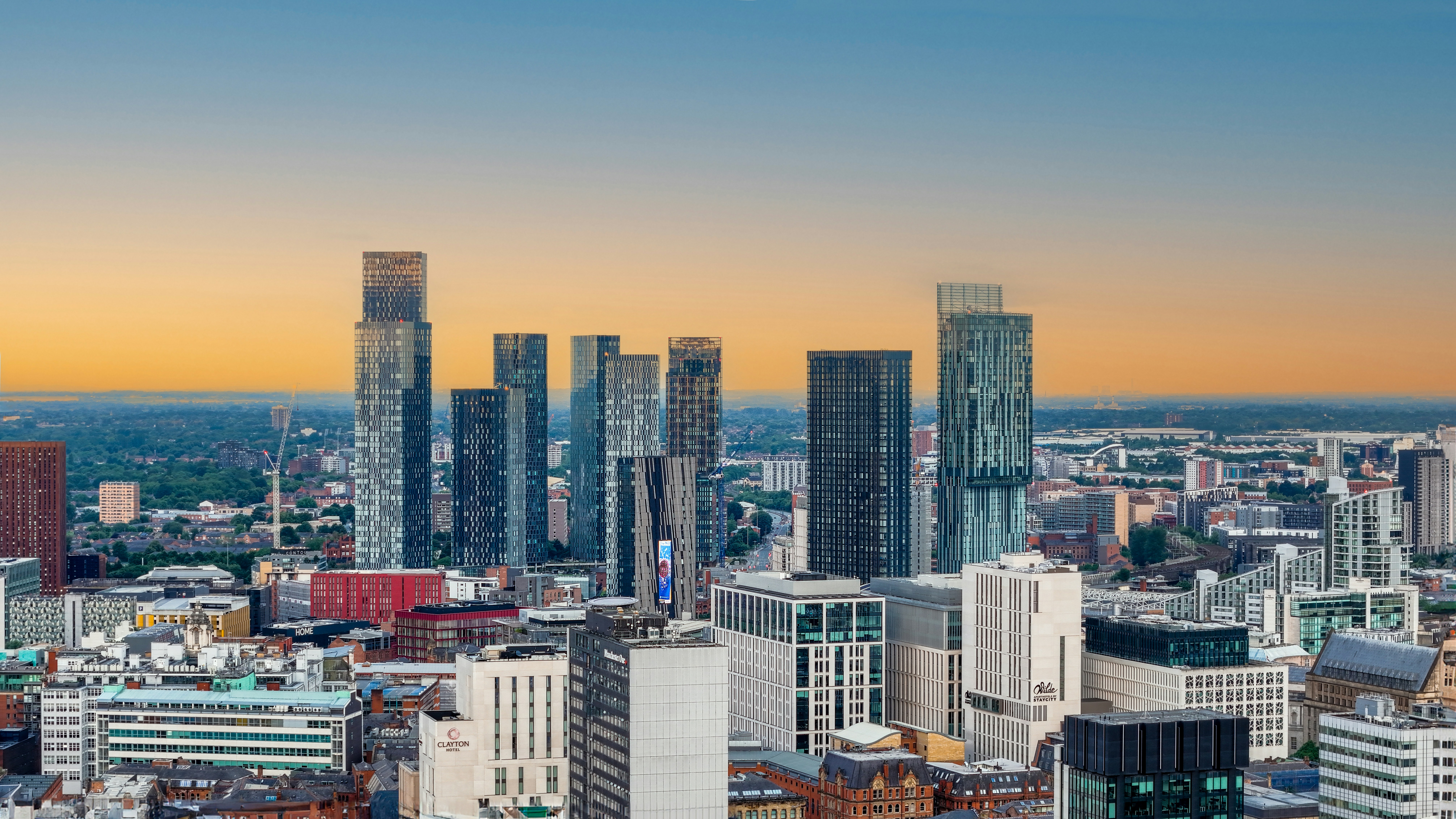 Manchester city centre at sunset, looking across the Deansgate towers.